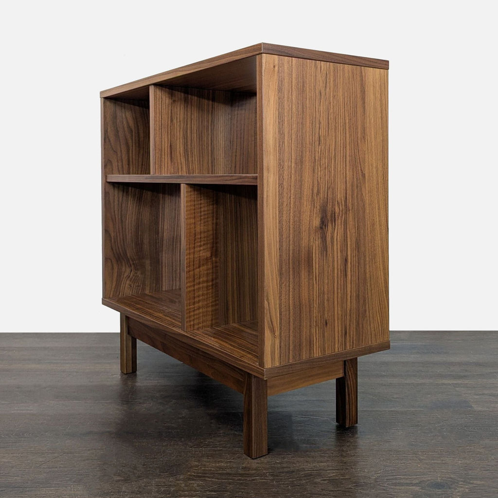 Modern wood bookshelf by Room & Board, ideal for small spaces, with open shelves for books and decorations.