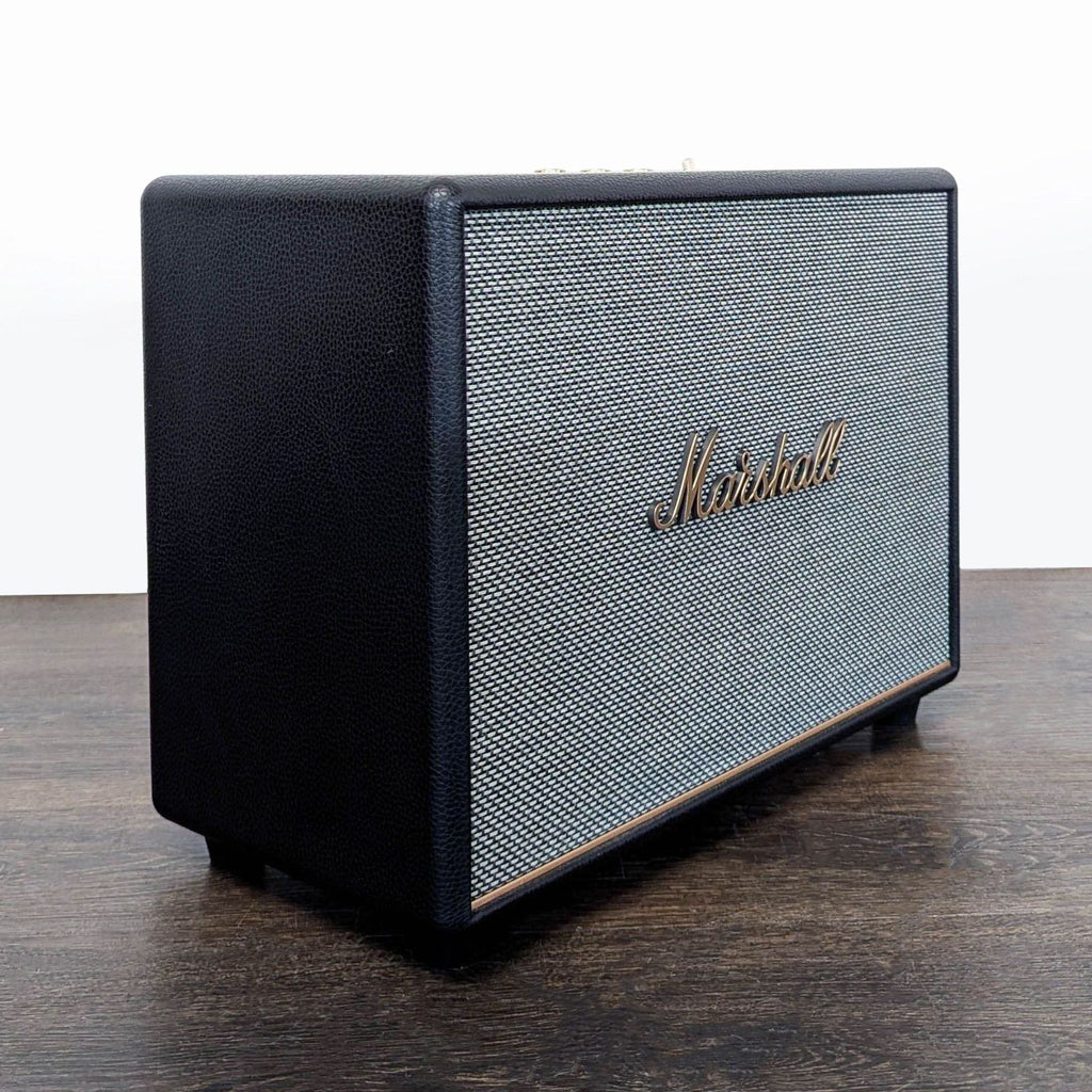2. Sleek Marshall speaker with vintage-inspired look, showcasing textured grille and signature script branding.