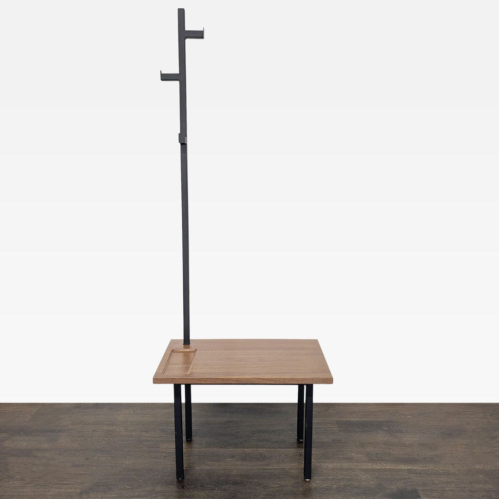 Modern bench coat rack by Room & Board with wood seat, metal legs, and hooks for entryway storage.