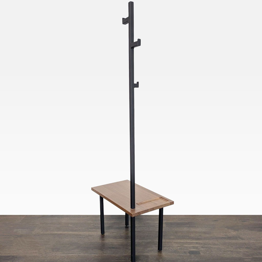 Entryway bench with sturdy wood top, black metal legs, and upright post with hooks for organizing essentials.