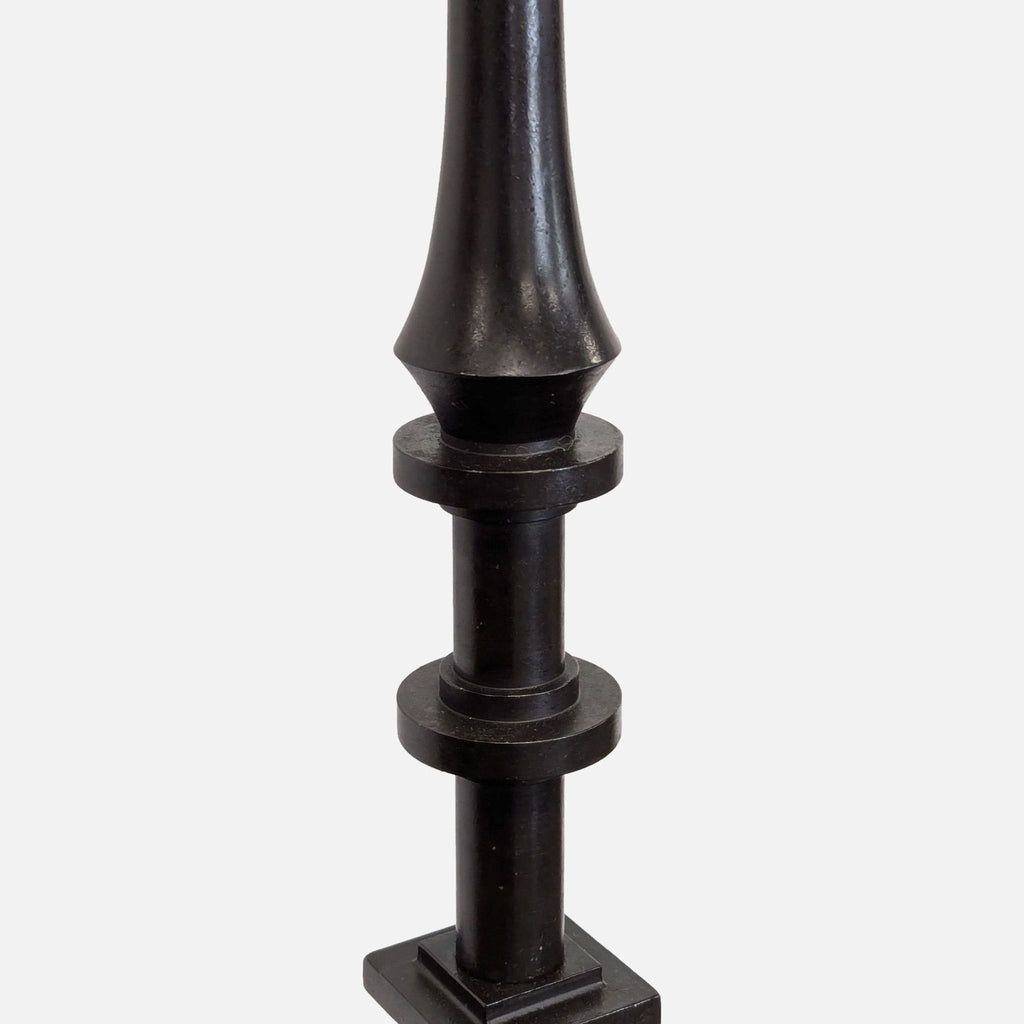 Modern floor lamp featuring a sturdy black metal base, decorative stem, and clean white lampshade.