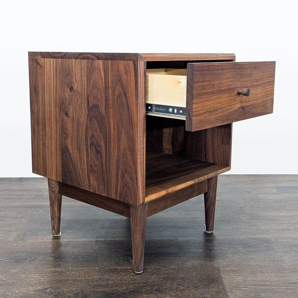 2. Sleek contemporary end table by Room & Board, featuring a sturdy square top and open steel base.