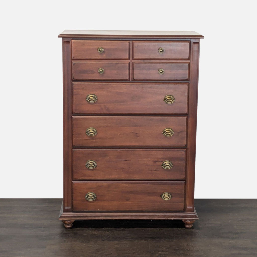 Broyhill wood dresser with chestnut finish, five drawers, and brass handles for classic bedroom storage.