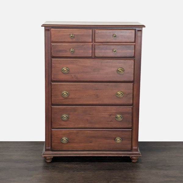 Broyhill wood dresser with chestnut finish, five drawers, and brass handles for classic bedroom storage.