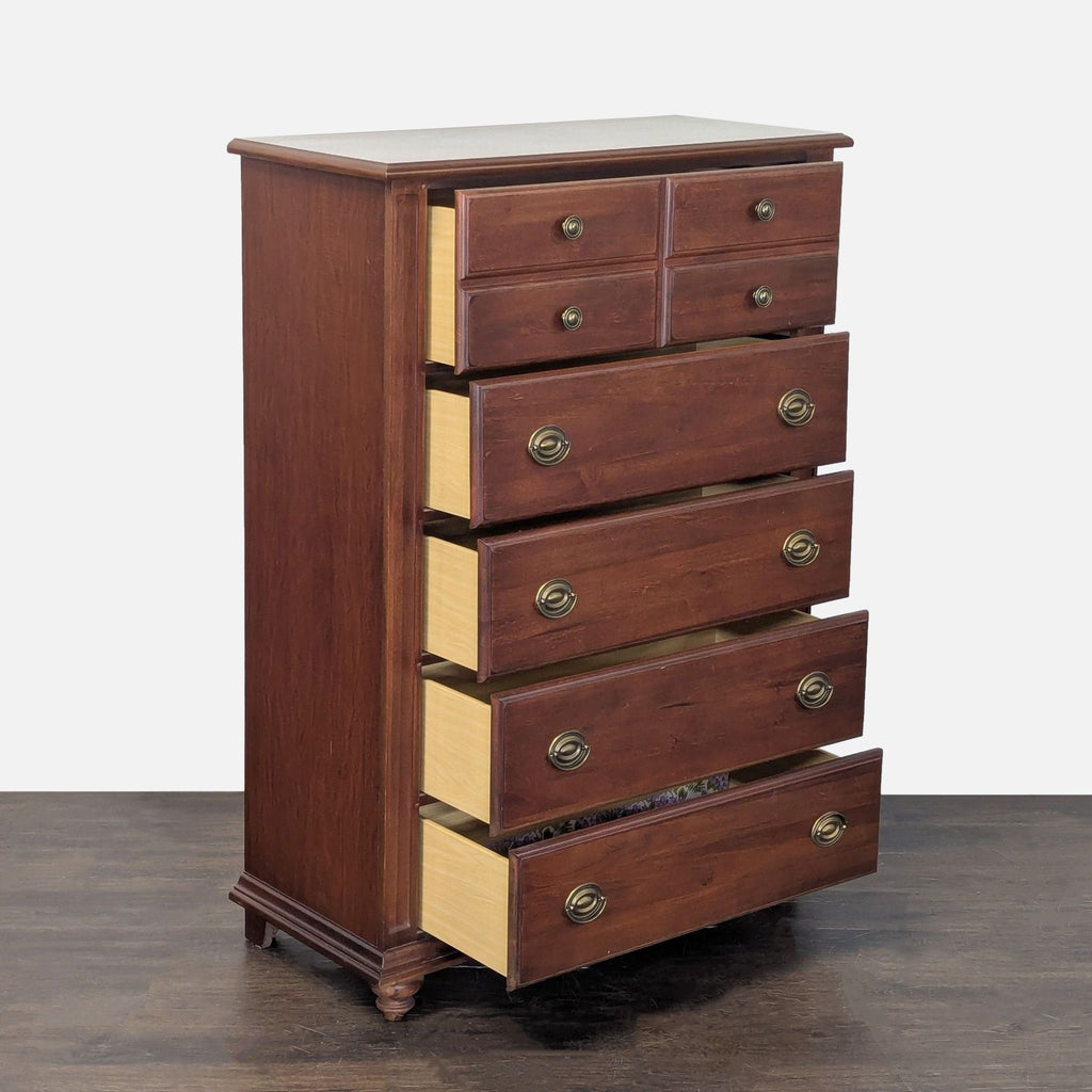 Chestnut-finished Broyhill dresser featuring five spacious drawers and elegant brass handles for organization.
