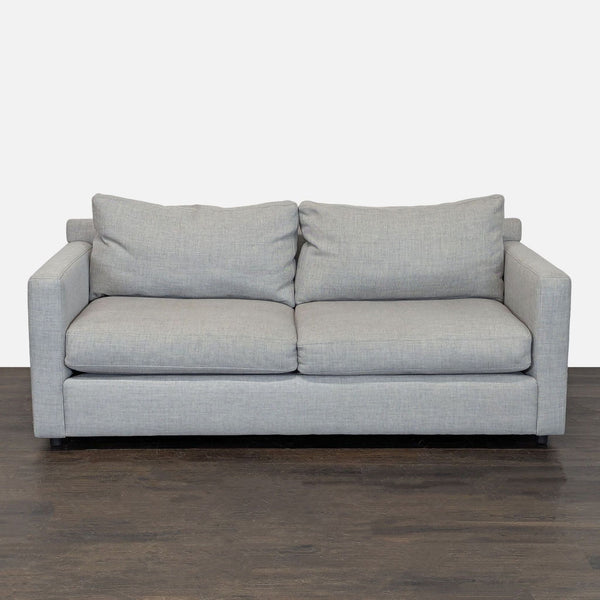 Crate & Barrel loveseat with light gray fabric upholstery, modern straight arms, and plush cushions for two.