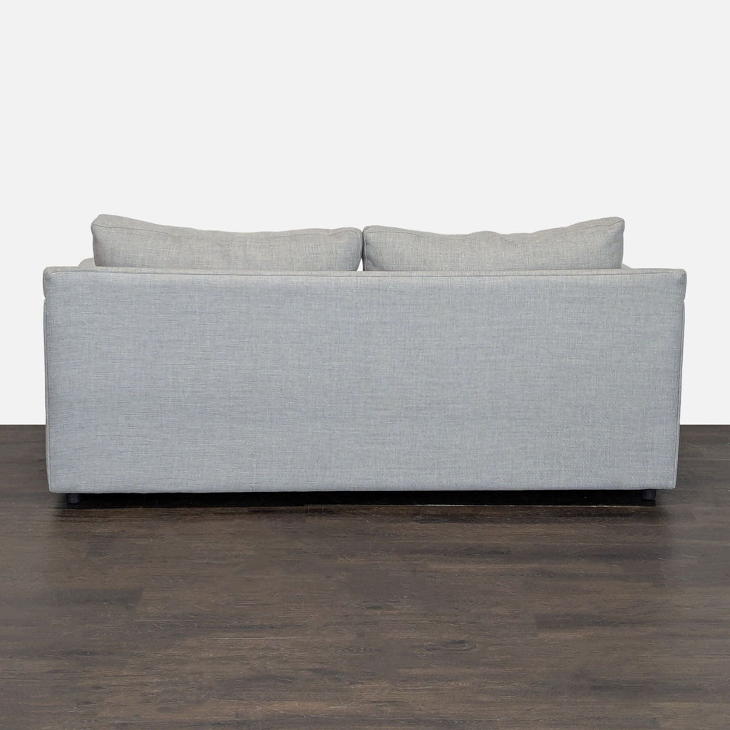 Gently used Crate & Barrel loveseat; seats two, neutral light gray upholstery, ideal for small living spaces.