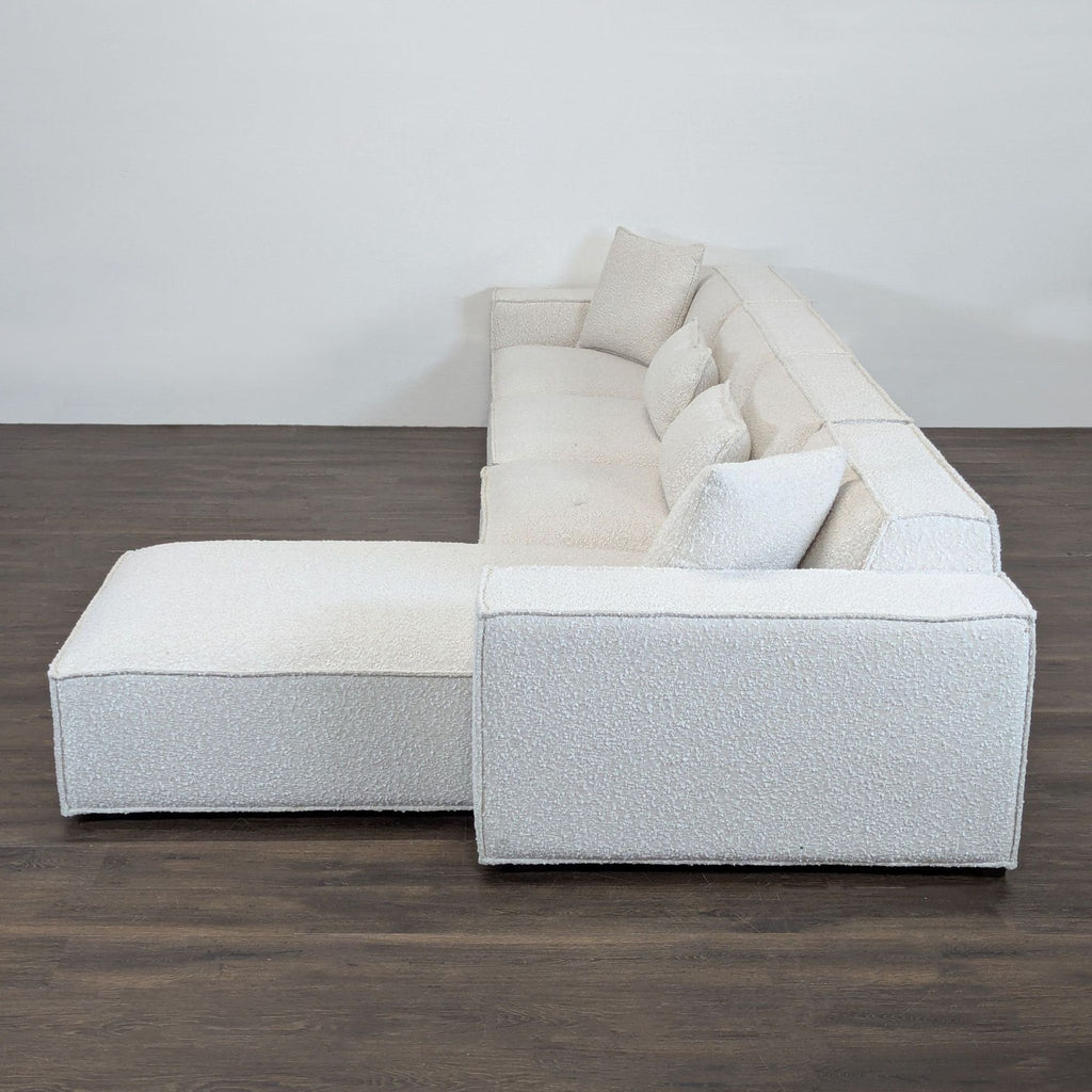 Contemporary Rove Concepts sectional with clean lines, cozy chaise, and plush pillows for stylish lounging.
