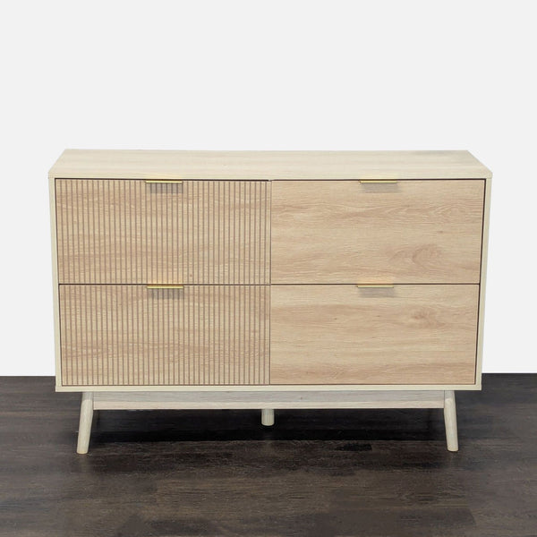 George Oliver dresser with four textured drawers, gold handles, and tapered legs in a light wood finish.