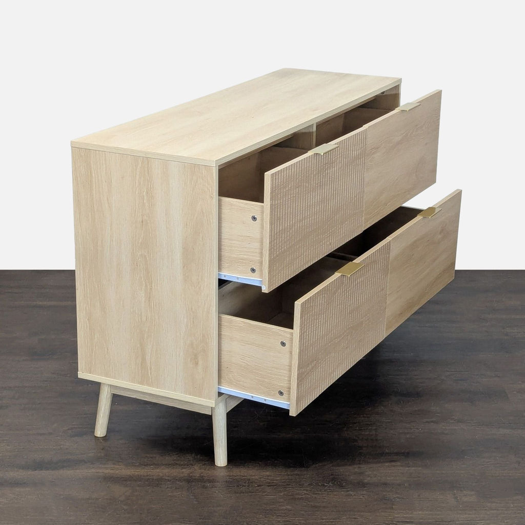 Modern George Oliver dresser features spacious drawers, unique texture, and gold accents in a mid-century style.