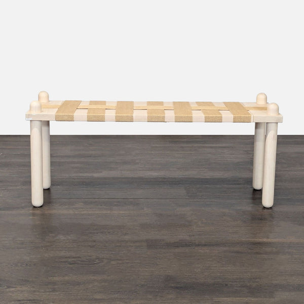 Handcrafted maple bench with whitewashed finish, featuring jute crisscross webbing and rounded legs.  