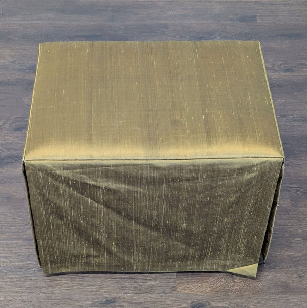 1. Rectangular Century ottoman with olive green fabric cover, placed on a dark wooden floor.