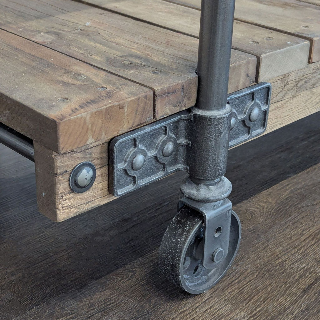 Industrial-style Pottery Barn console table crafted from reclaimed wood and metal accents, front view.