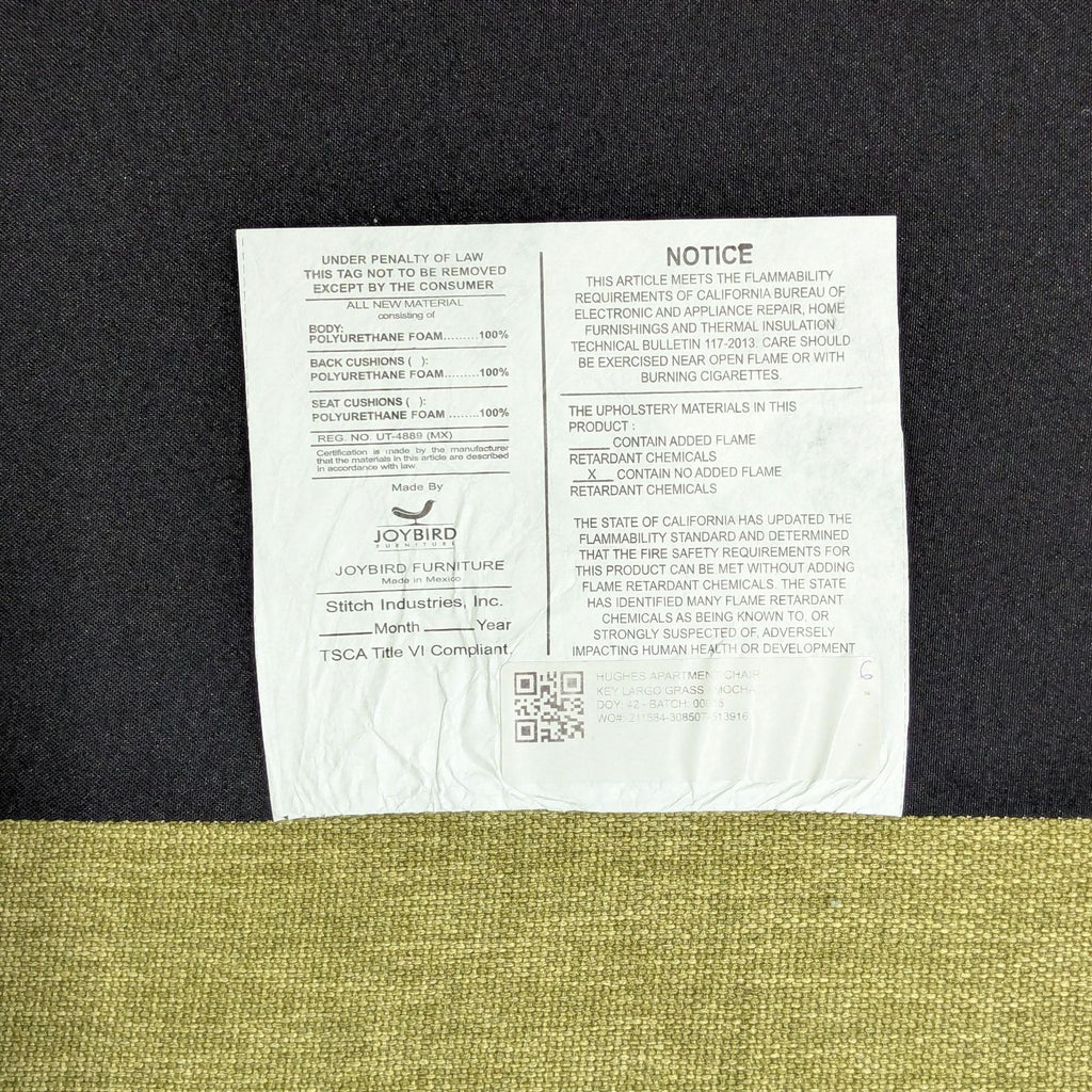 2. Joybird lounge chair tag displays flammability notice, material info, and manufacturer details.