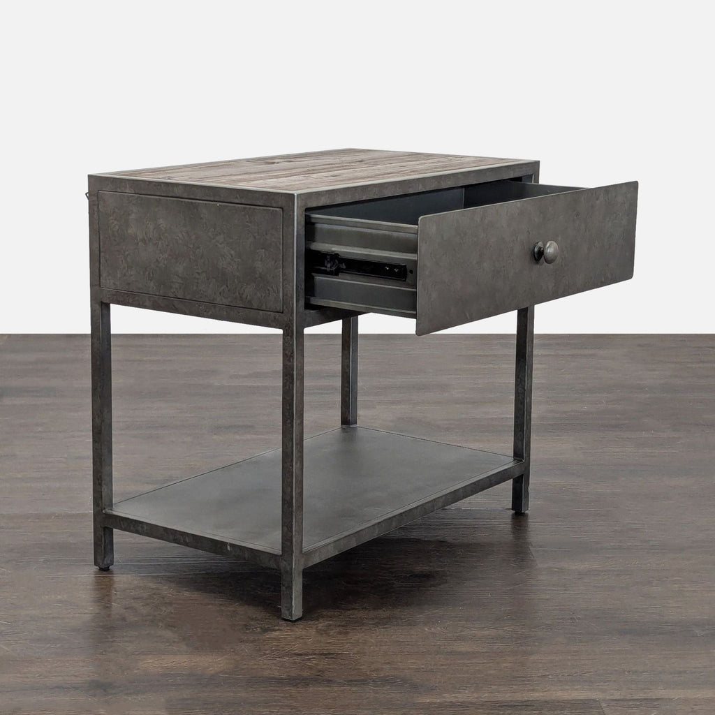 3. Pottery Barn metal end table with wooden top shown with drawer partially open, highlighting storage space.