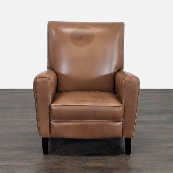 Brown leather Room & Board lounge chair with recliner, offering sturdy comfort and classic style.  