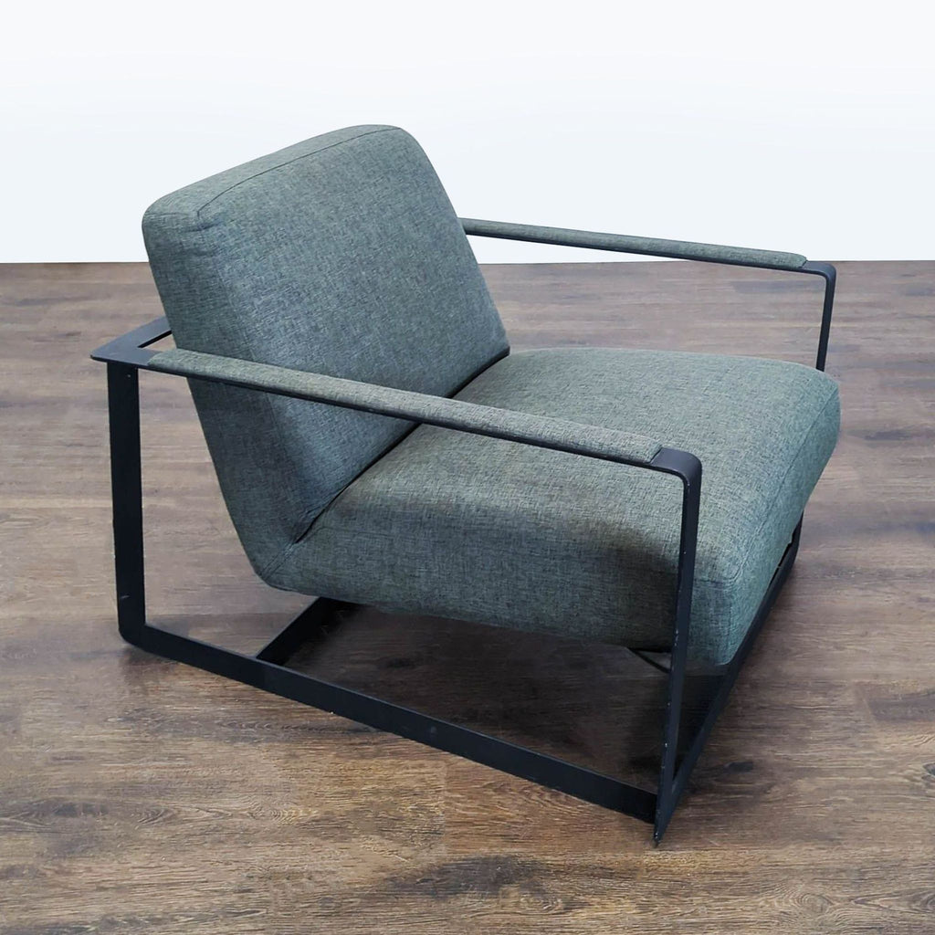2. Side angle of a modern Modway lounge chair showing wide cushioned seat and minimalistic black metal arms.