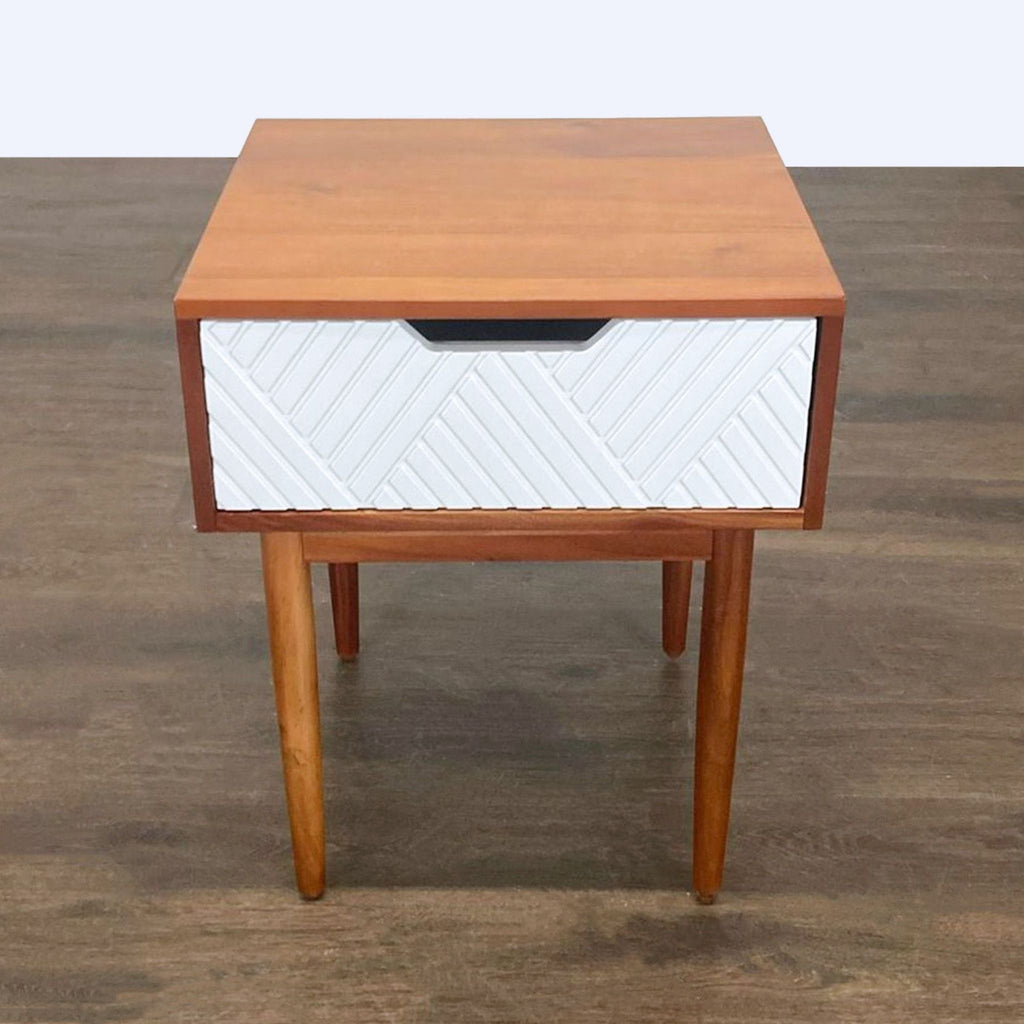 1. West Elm modern end table with a minimalist design and sleek finish, perfect for contemporary living spaces.  