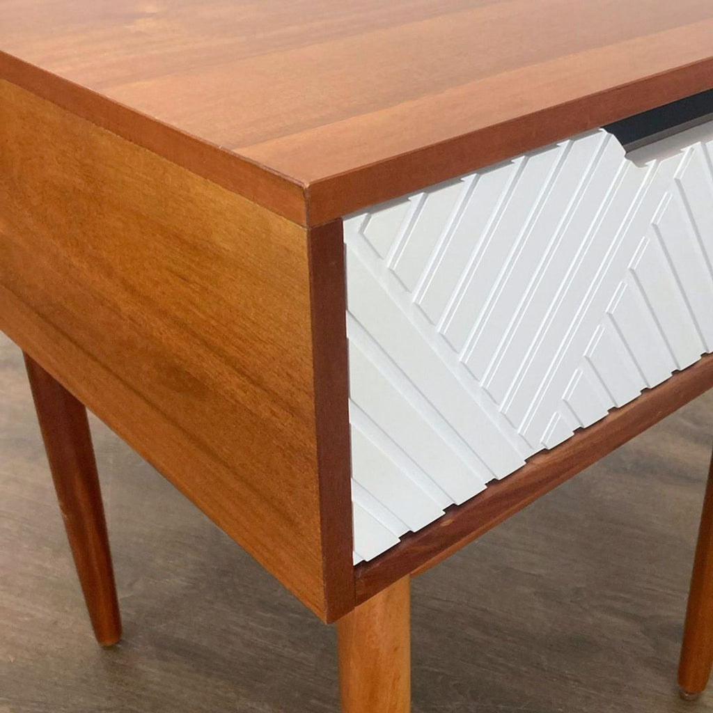 2. Stylish West Elm end table featuring clean lines and a compact form, ideal for small rooms or as an accent piece.  