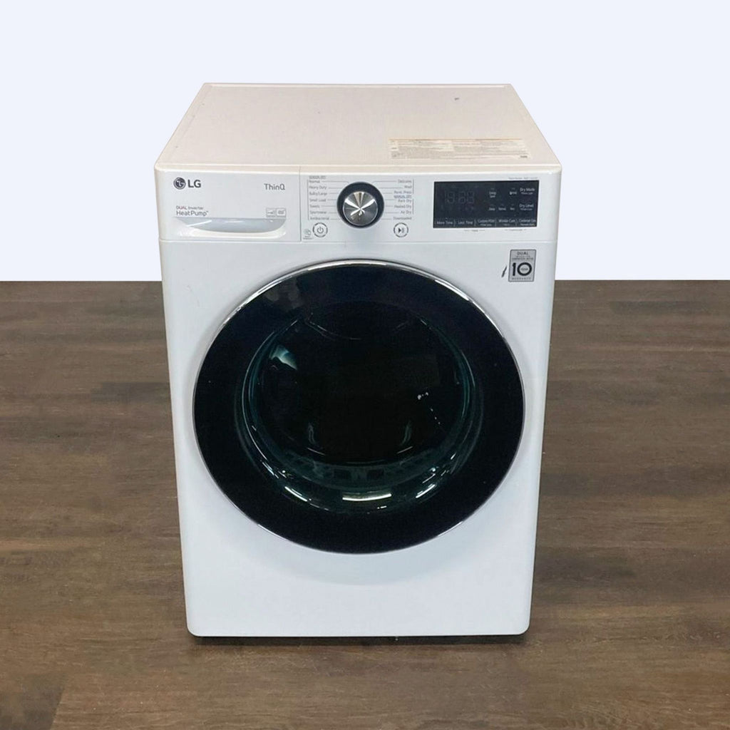 2. Front view of an LG brand washer/dryer with digital controls and a black door.
