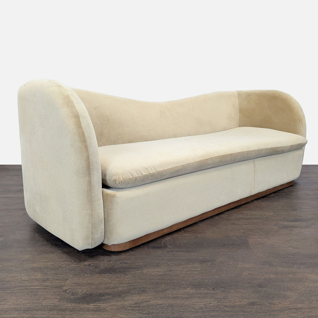 Modern beige 3-seater by West Elm featuring a curved silhouette and plush seating, perfect for any décor.