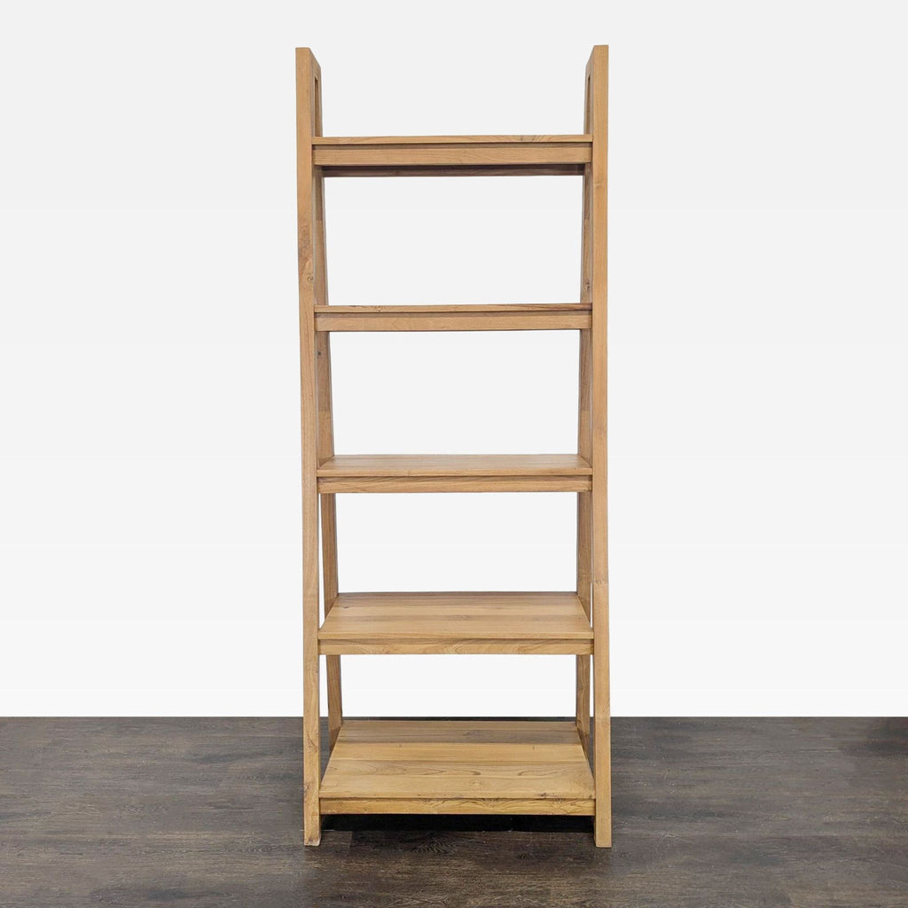 Crate & Barrel wooden bookshelf with four open shelves, ideal for storing books or decor in any modern room.