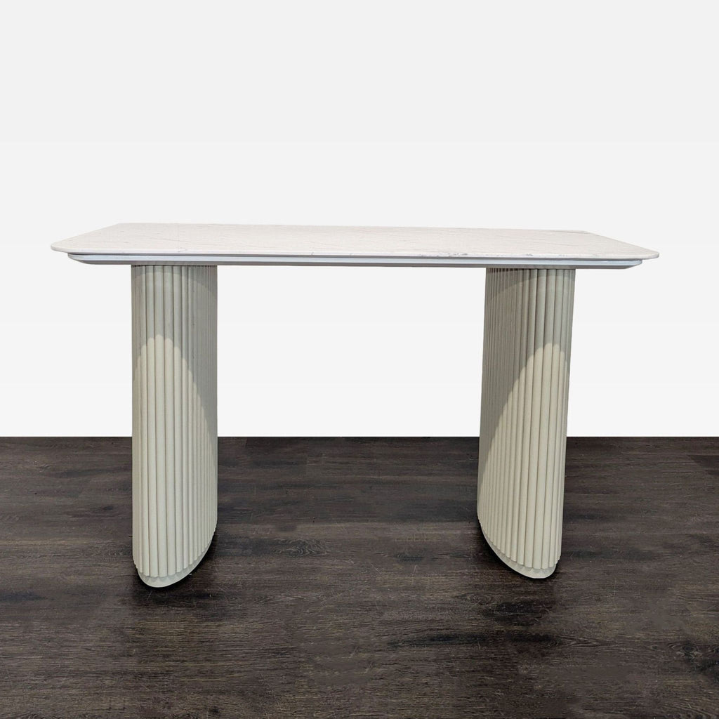 Sleek Rove Concepts desk with a white marble top and cream fluted legs, perfect for modern workspaces.  