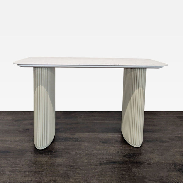 Sleek Rove Concepts desk with a white marble top and cream fluted legs, perfect for modern workspaces.  