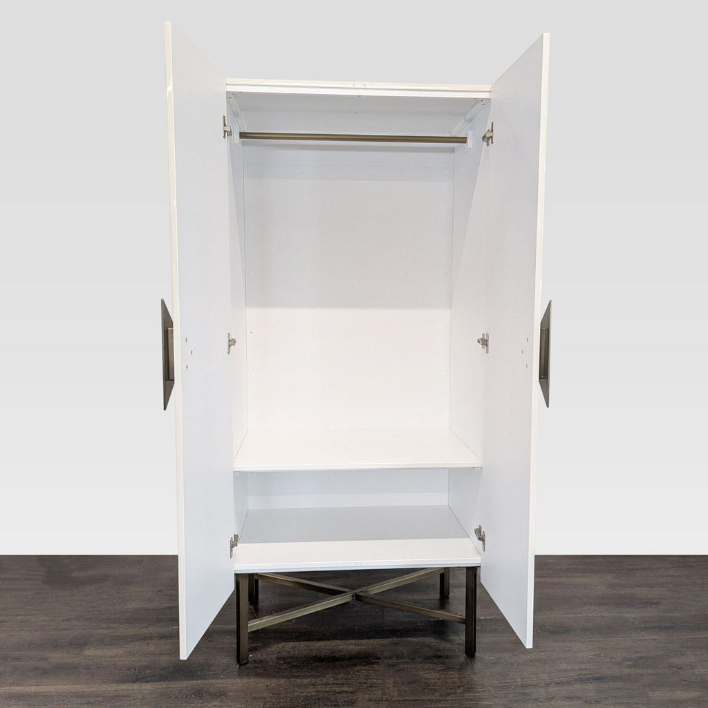 Modern wardrobe from CB2 featuring brass hardware, wood construction, and steel legs for clothing storage.  