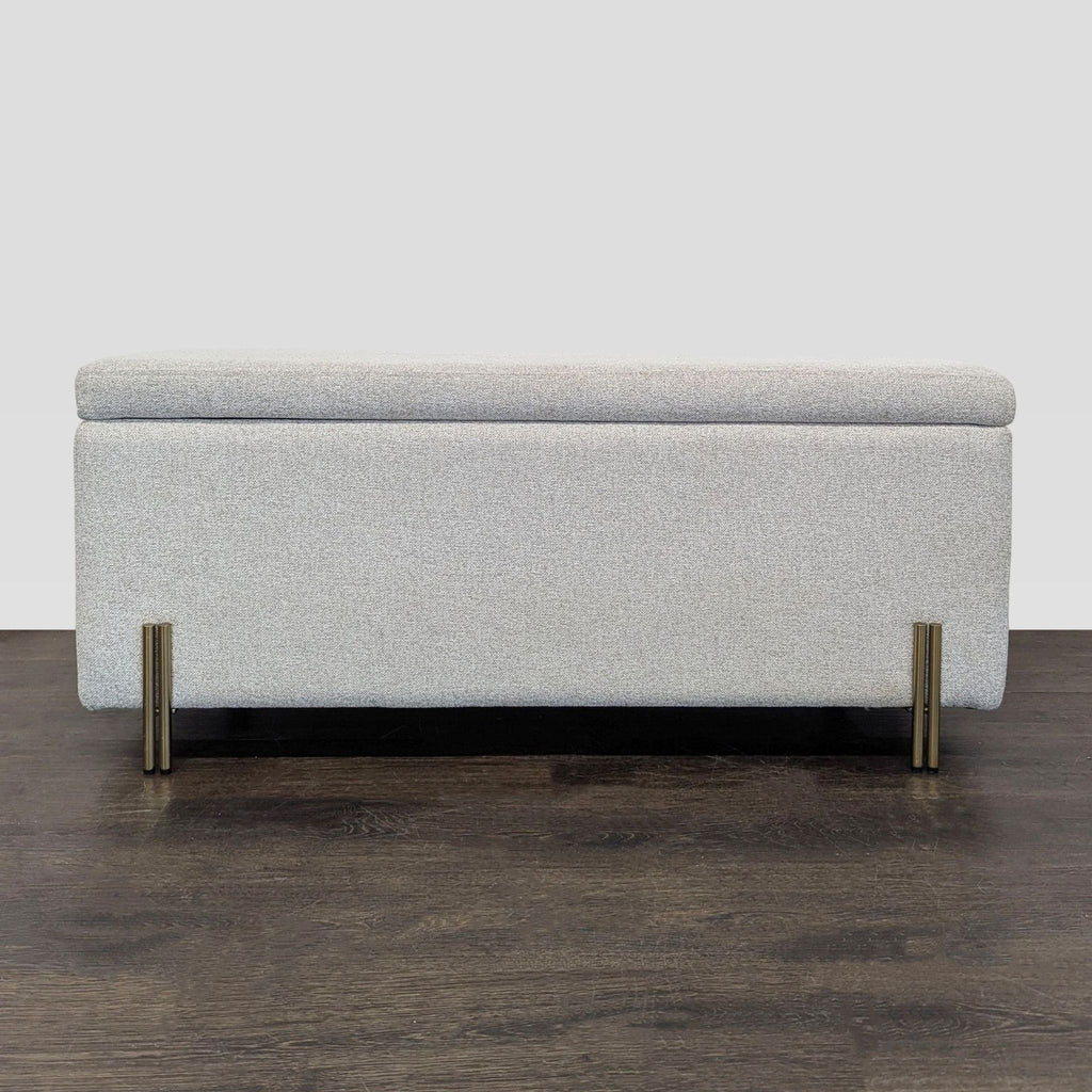 West Elm bench with antique brass iron legs and lift-up seat revealing hidden storage space.