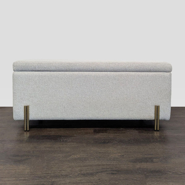 West Elm bench with antique brass iron legs and lift-up seat revealing hidden storage space.