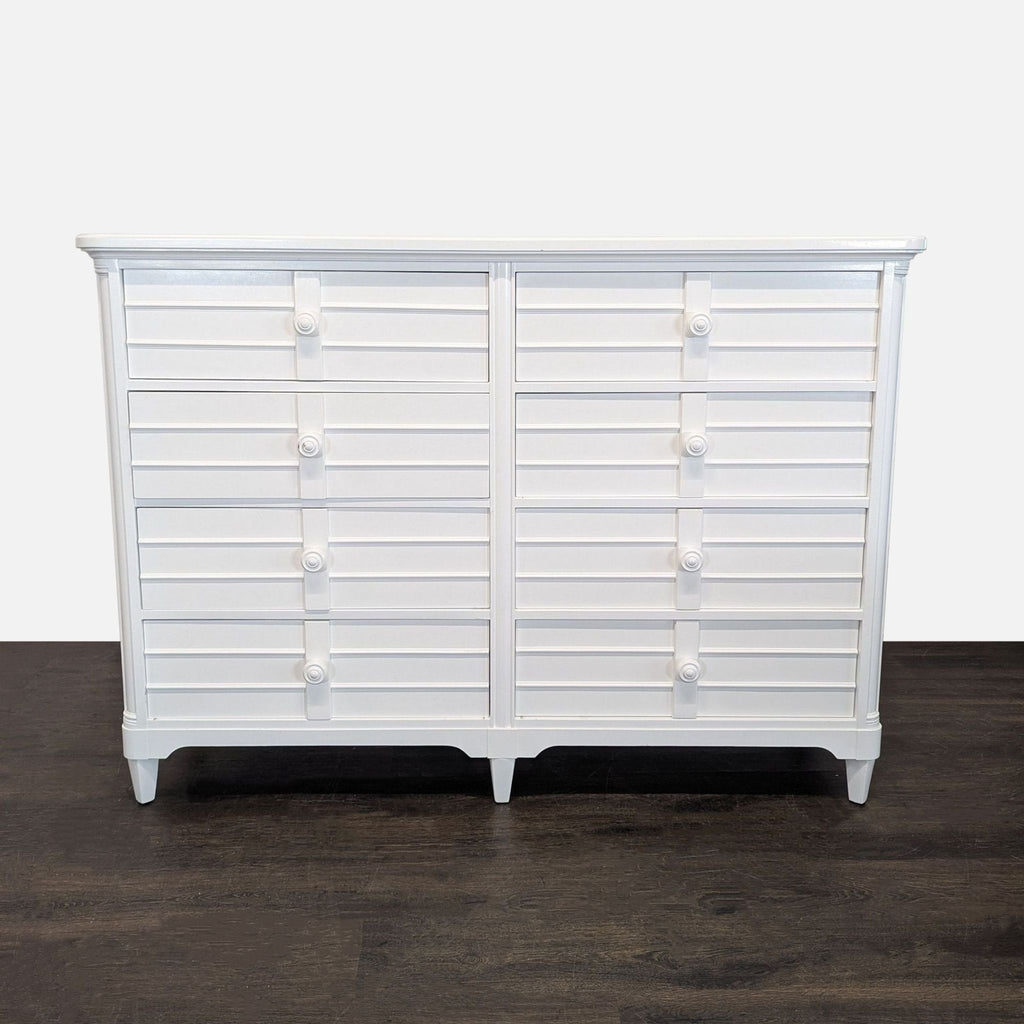 White Stanley Furniture dresser with louvered fronts and six roomy drawers, blending style and storage.  