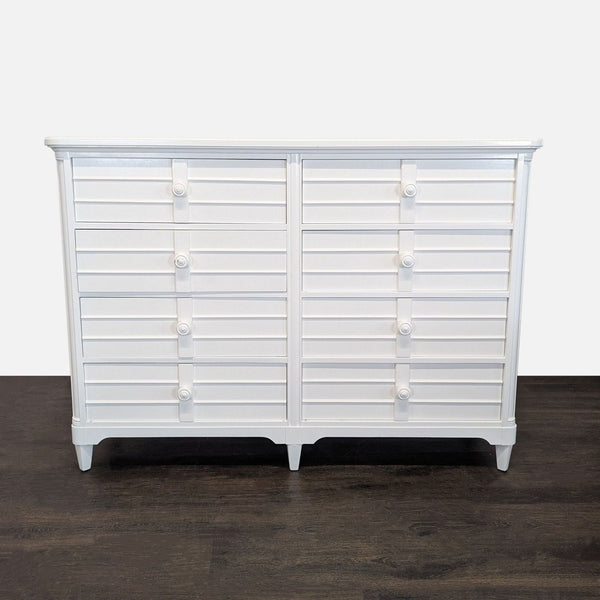 White Stanley Furniture dresser with louvered fronts and six roomy drawers, blending style and storage.  