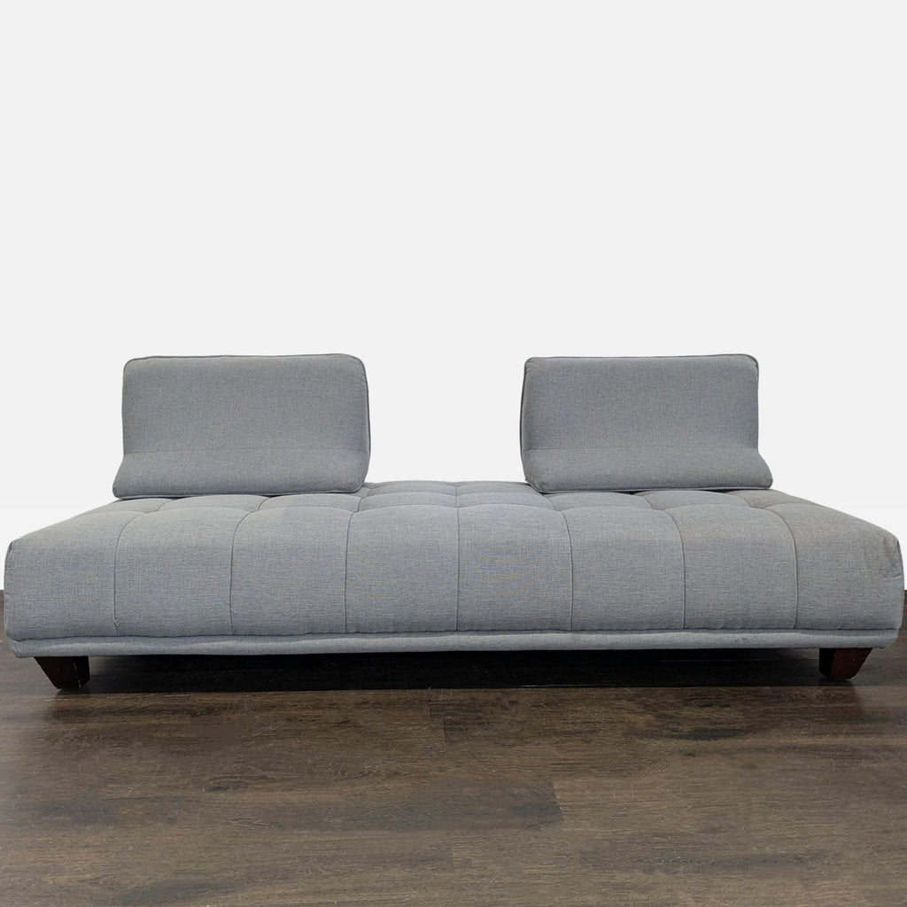 Grey 3-seat sofa featuring soft upholstery, clean lines, and customizable backrests for comfort.