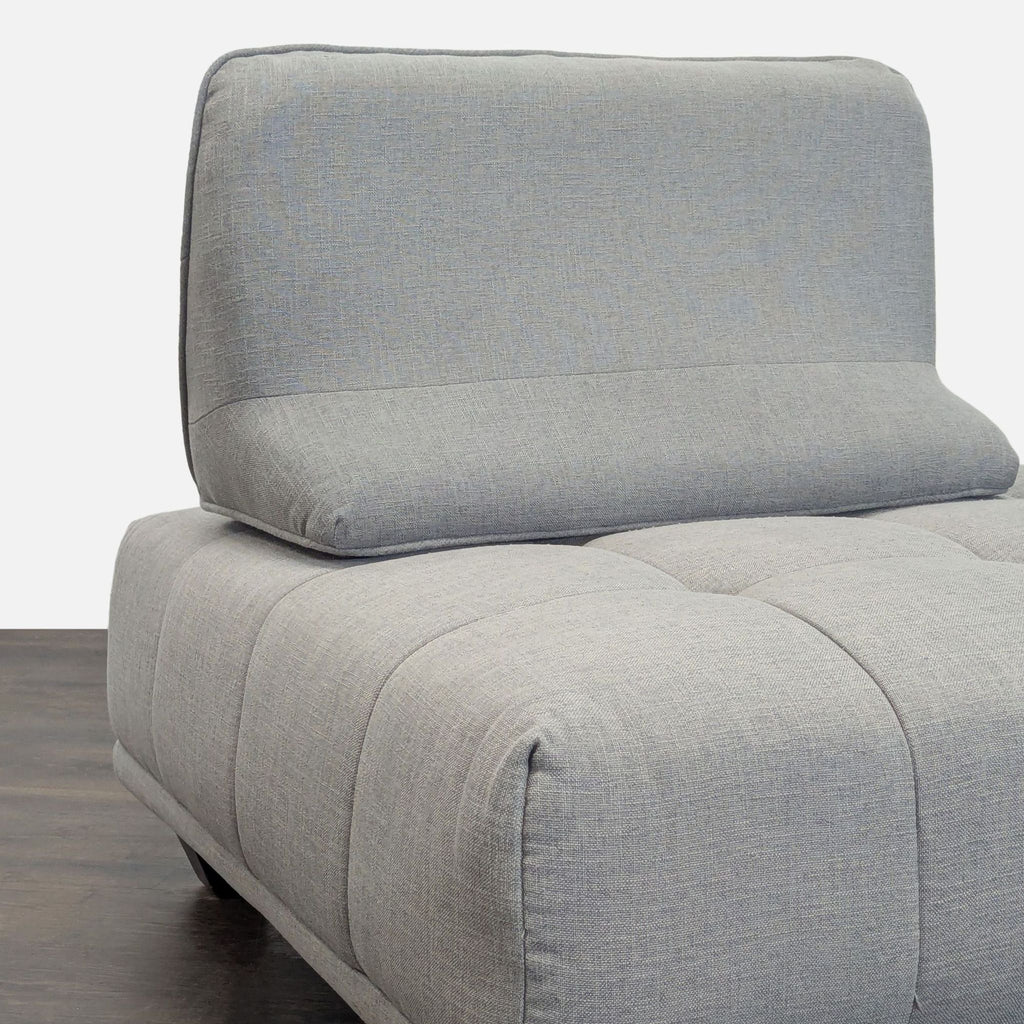 Contemporary three-seater sofa with adjustable backrests, stylish grey fabric, and minimalist look.