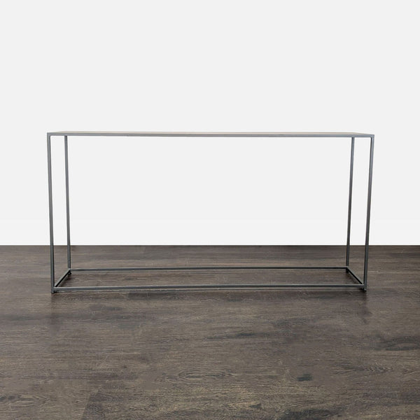 Sleek metal side table with a slim profile from CB2, perfect for modern interiors.  