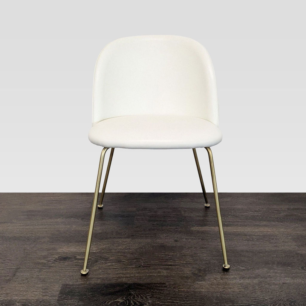 Mid-century modern dining chair by Rove Concepts featuring curved upholstery and slim industrial legs.  