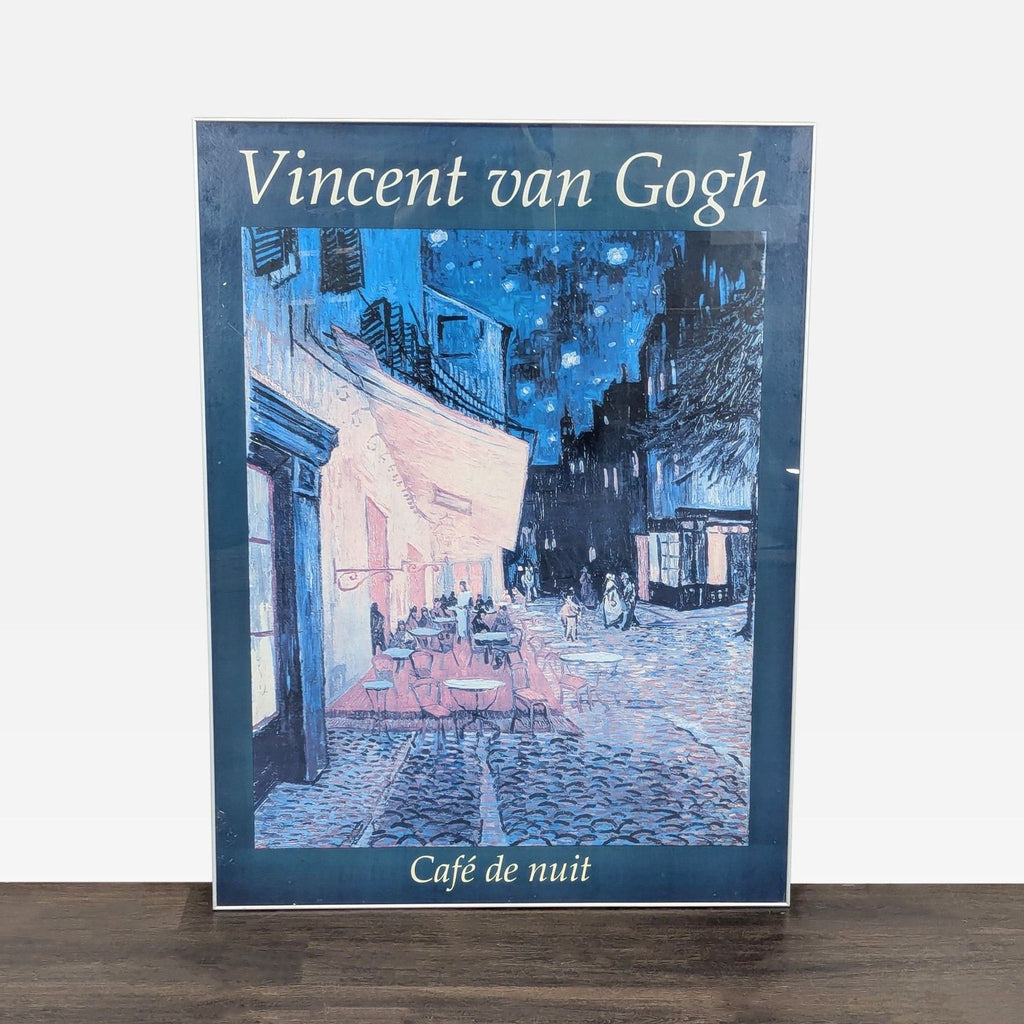 Framed print of Van Gogh’s “Café de nuit,” featuring a vibrant night café in blues and yellows, ready to hang.