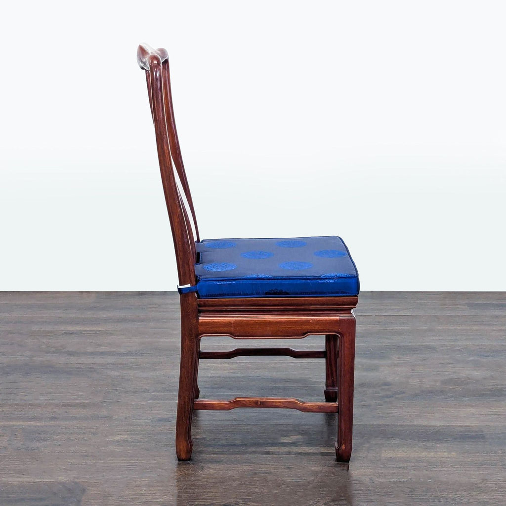 2. Elegant dining chair featuring a curved backrest and slender metal legs.