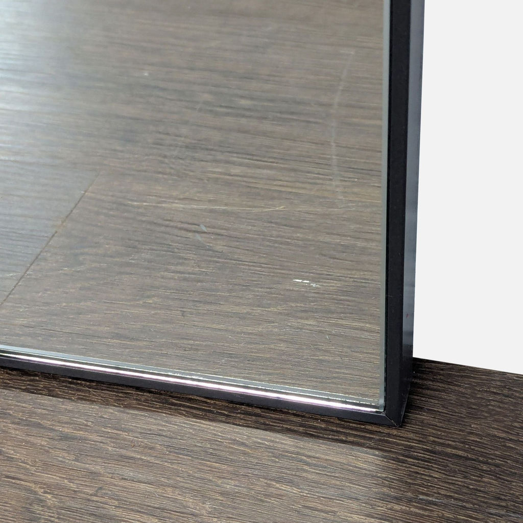 Sleek black-framed square mirror from Pottery Barn, ideal for contemporary rooms.  