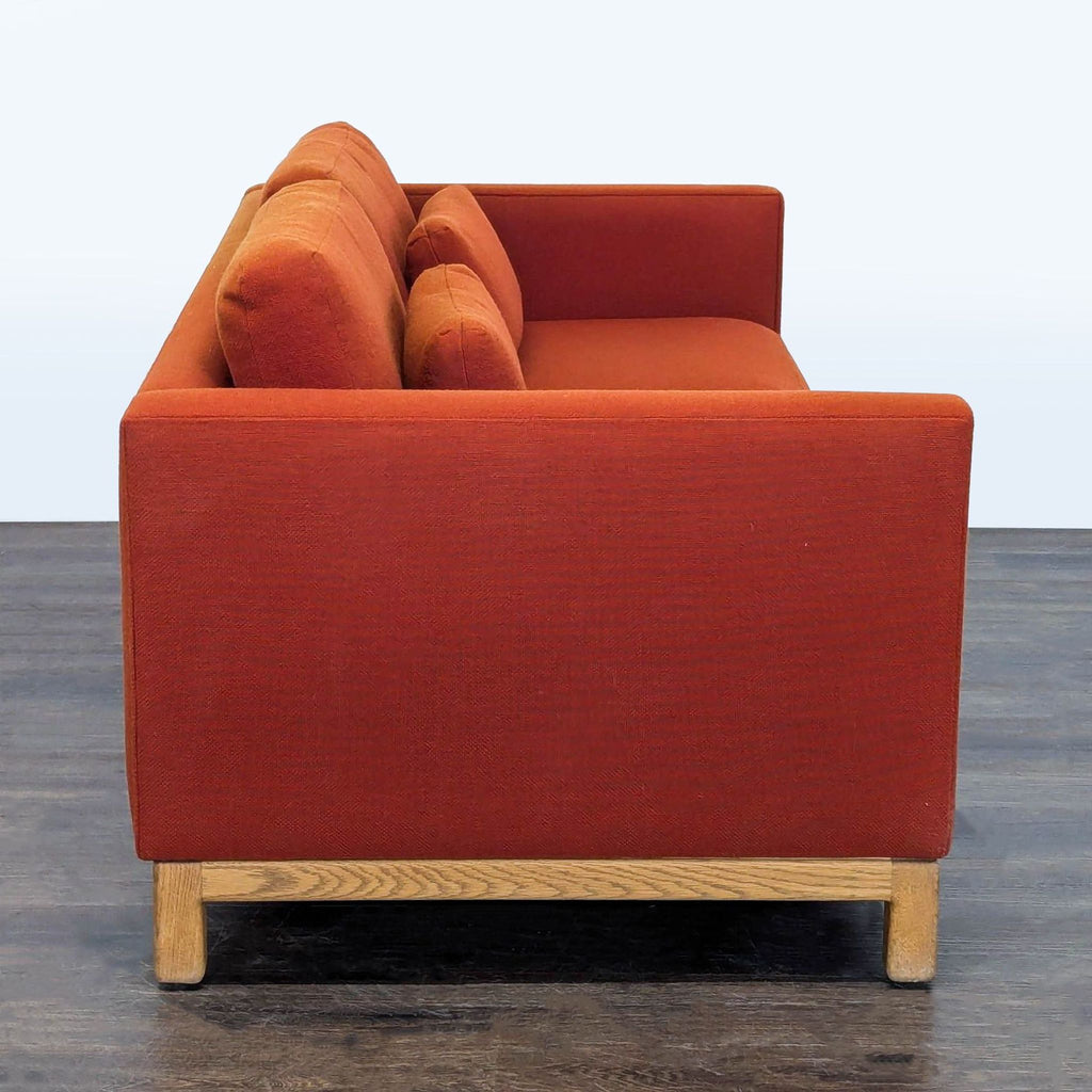 2. Compact loveseat in soft beige upholstery, ideal for small living room spaces.