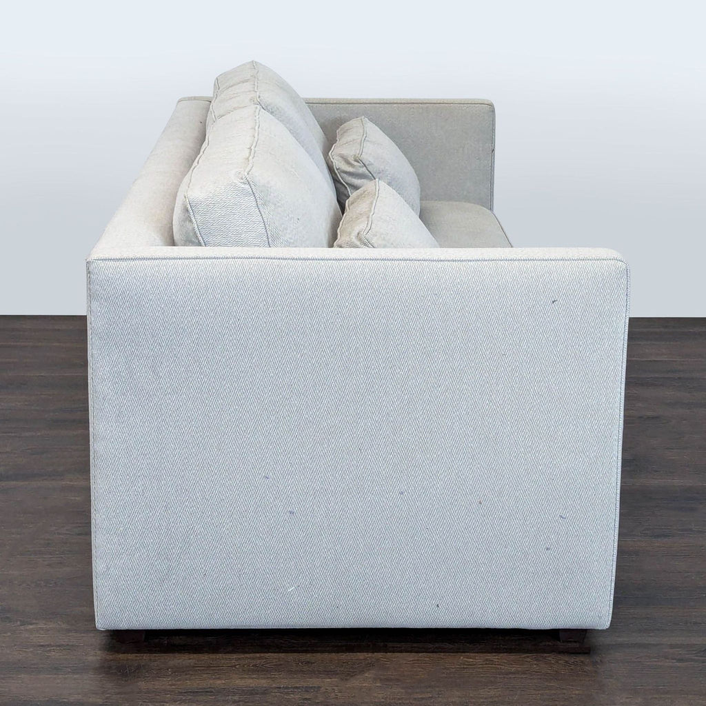 Contemporary Room & Board three-seat couch, highlighting clean lines and plush cushions.