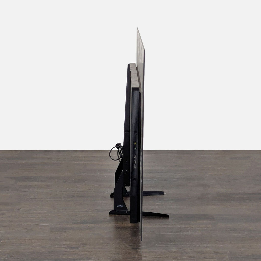 3. Sony brand TV set on a stand, featuring a thin bezel and sharp picture quality.