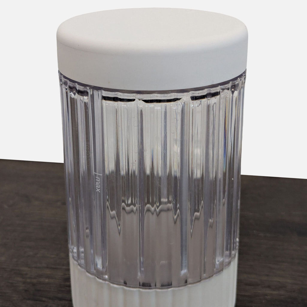 Small Beast blender for smoothies and shakes, includes clear jar and durable power cord for daily use.