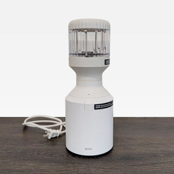 Beast mini blender with clear jar, compact design, and single button for easy countertop blending.