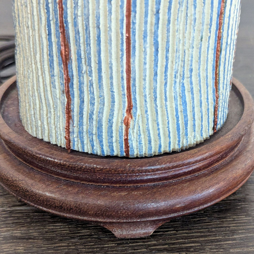 Modern Table Lamp with Beige Fabric Shade and Striped Pottery Base