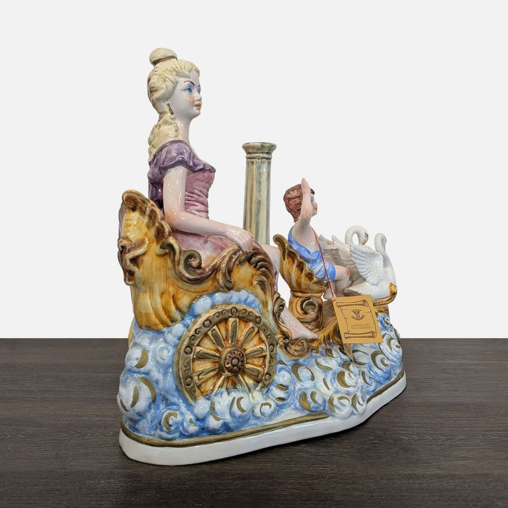 Elegant Capodimonte figurine of a woman seated in a decorated porcelain chariot with a cherub and a swan.
