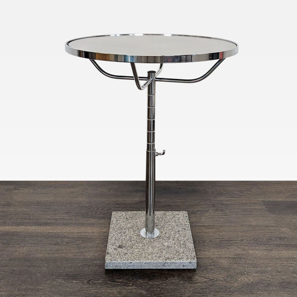 Glass side table with a clear top and decorative faux stone base.  