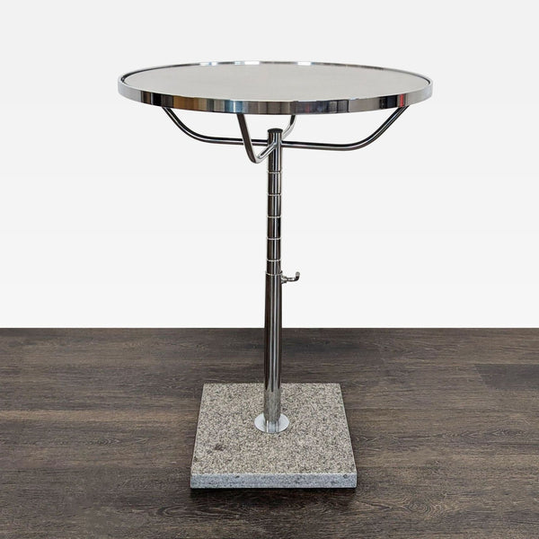 Glass side table with a clear top and decorative faux stone base.  