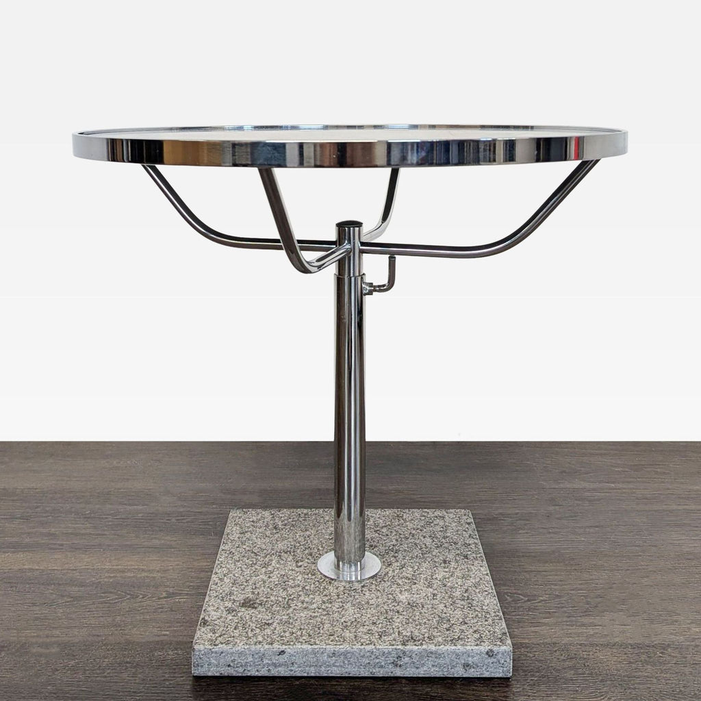 Modern side table with a transparent glass surface and stylish faux stone pedestal.